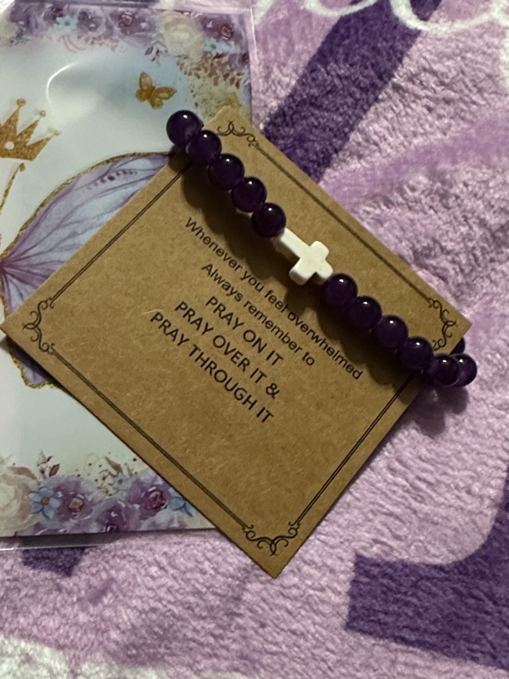 Purple Beaded Cross Stretch Bracelet with Prayer Card packaged in butterfly bag